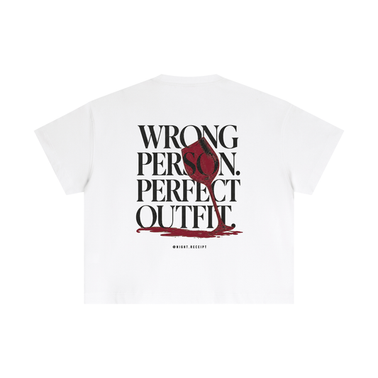 Back of the white Night Receipt boxy cotton tee with WRONG PERSON. PERFECT OUTFIT. in editorial serif capitals and a tipped oxblood wine glass whose spill becomes the baseline