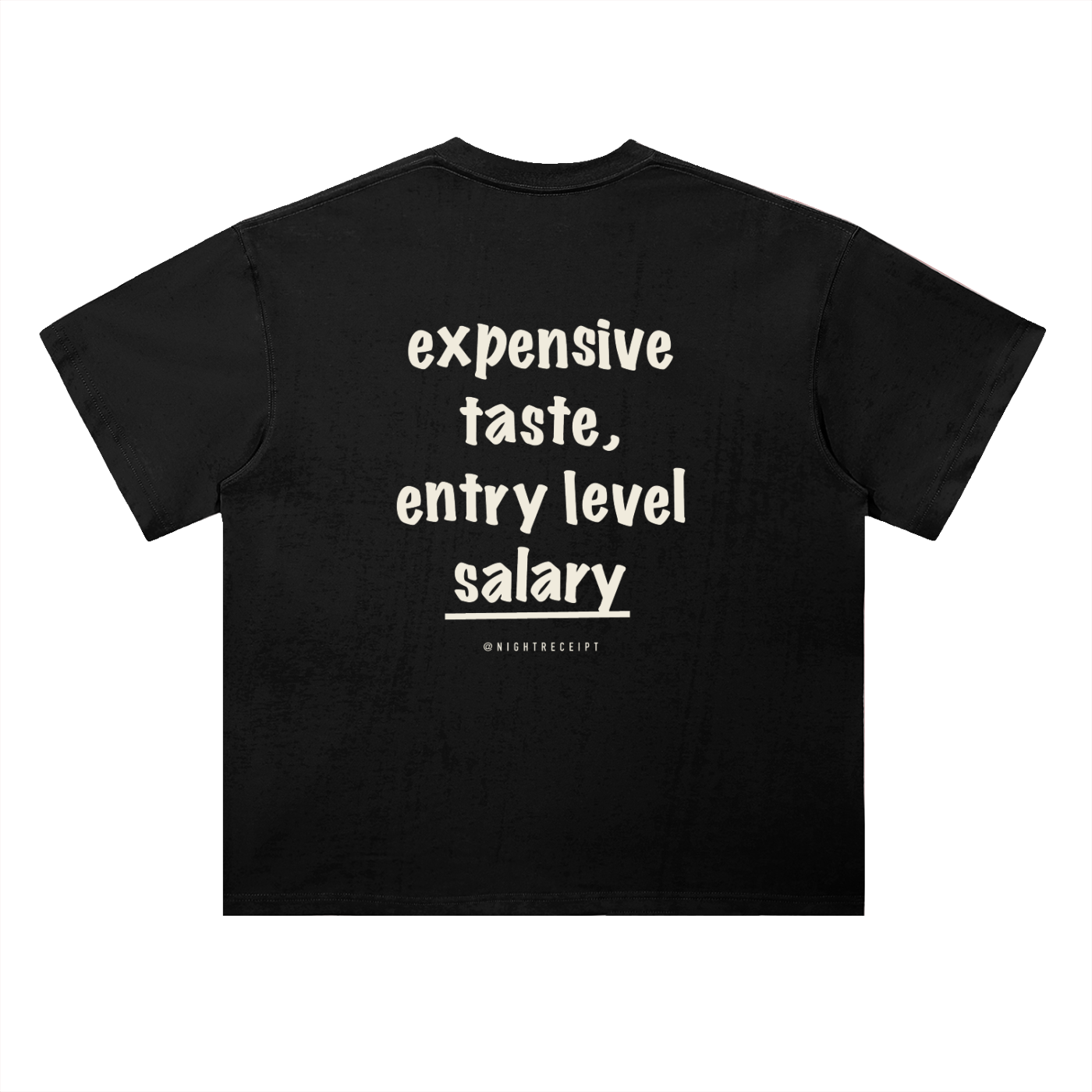 Back of the black heavyweight drop-shoulder tee with expensive taste, entry level salary in cream hand-drawn marker lettering