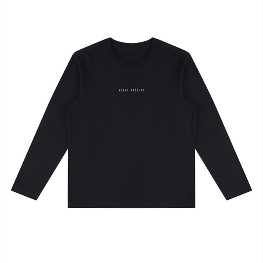 Front of the black heavyweight long sleeve tee with the small centred NIGHT RECEIPT chest wordmark in cream